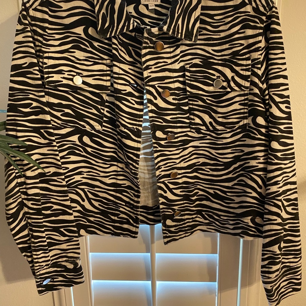 New John & Jenn Size XS petite black and white leopard print jean jacket.